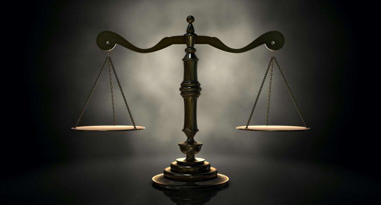 Scales of justice on dark bg Anderson Jung law firm Los Angeles | Bus Accidents | Anderson & Jung Law